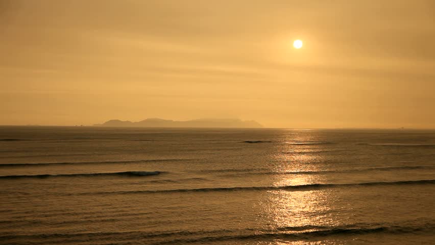 Sunset over the pacific ocean in lima, Peru