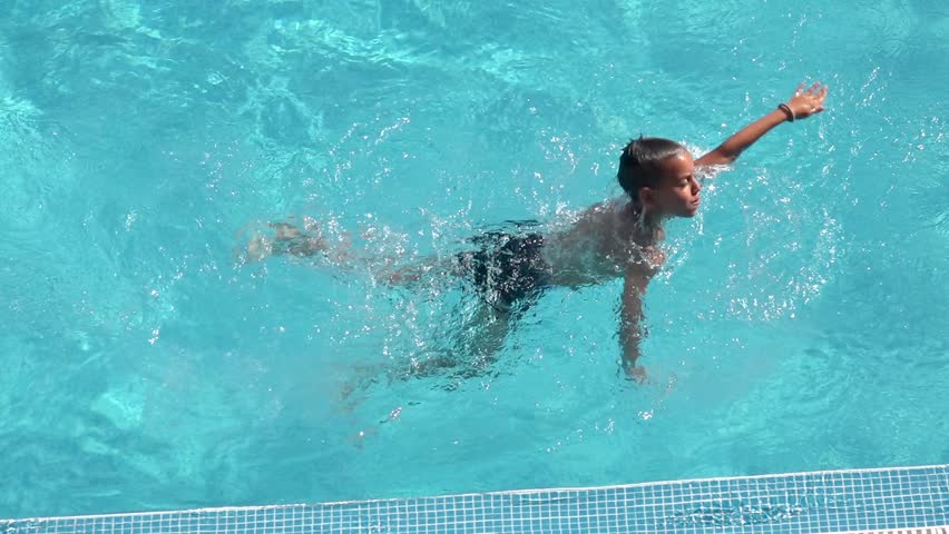 little boy swimming