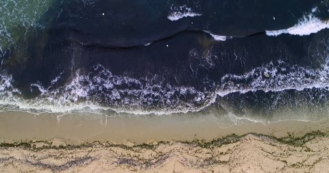 Oil pollution in sea shore shoot from above with drone
