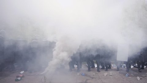 A special unit of the government police SWAT involved in clashes with protesters against football fans, rebellion and mob violence, smoke and army
