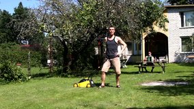 Young freak mowing lawn by lawnmower. Freddie Mercury ‘’ i want to break free’’ parody. Funny, humor, humorous.Funny, humor, humorous.