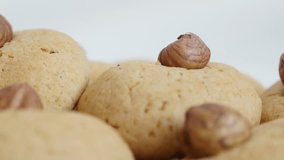 Shallow DOF biscuit snack with hazelnut  stacked 4K 2160p 30fps UltraHD panning footage - Slow pan over fresh and tasty home made cookies on pile 3840X2160 UHD video