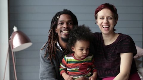 Portrait of happy diverse family with son at home Stock Video