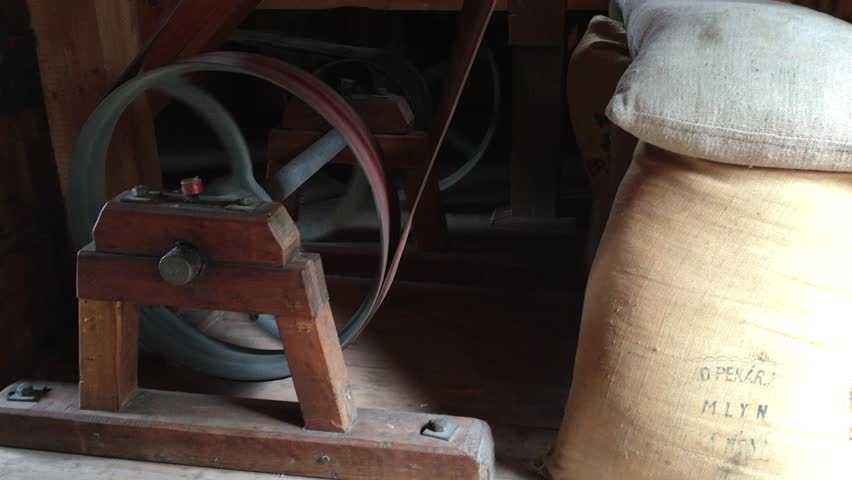 Detail of old vintage industrial mill wheels in operation