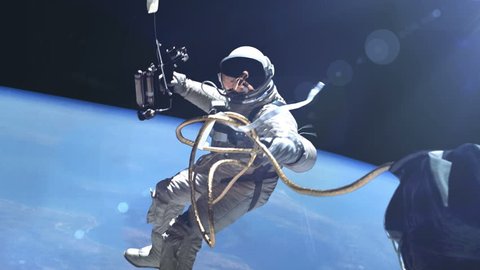 Стоковое видео: Astronaut in outer space against the Earth background. Elements of this image furnished by NASA.