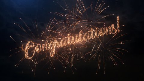 Congratulations greeting text with particles and sparks on black night sky with colored slow motion fireworks on background, beautiful typography magic design.