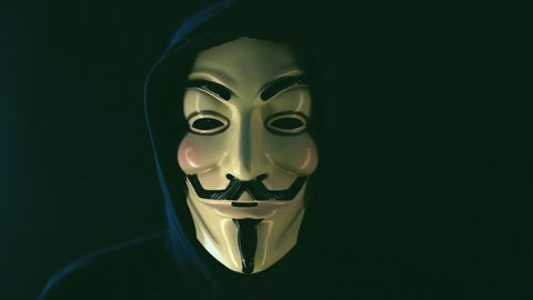 Aachen, Germany - March 01, 2017: Studio shot of Anonymous computer hacker wearing Guy Fawkes vendetta mask on March 01, 2017. 