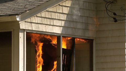Fire and flames on porch of house