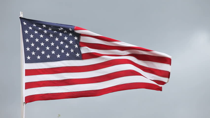 national flag of USA waving on the fitful wind