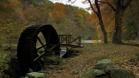 Old fashioned water wheel spinning