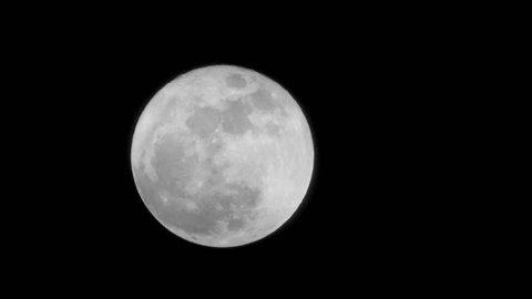 Full moon time-lapse as it eventually becomes obscured by clouds