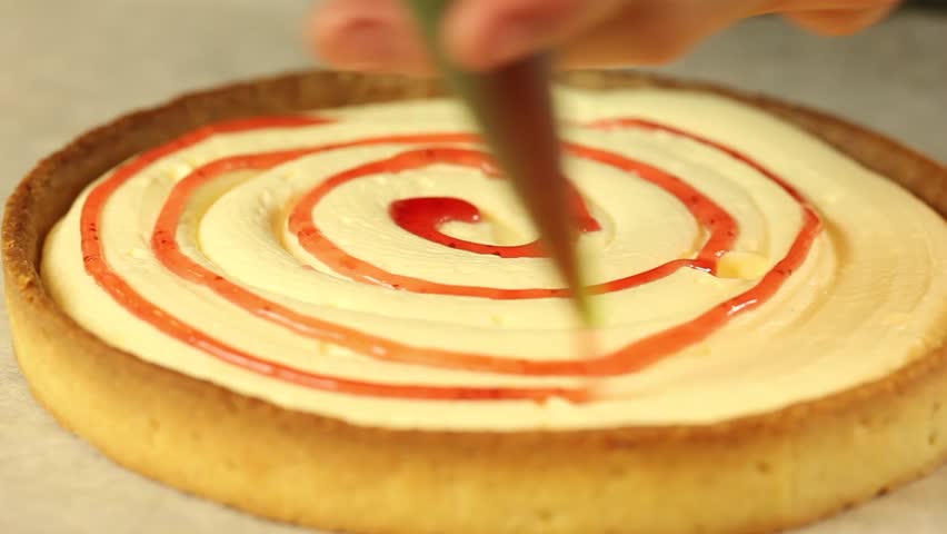 tart decoration with red coulis
