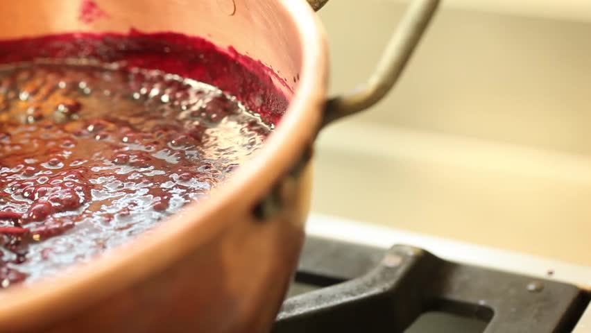 red fruit marmalade in copper pot pan left
