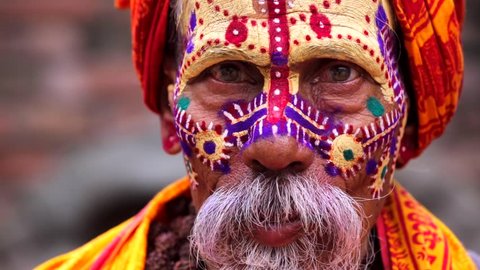 Portrait of sadhu (religious ascetic or holy person) who looks into the camera in the Pashupatinath temple complex that is on UNESCO World Heritage Sites's list Since 1979. Kathmandu, Nepal.