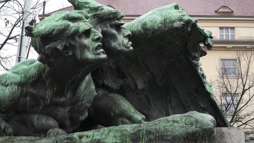 Close up to faces of Monument of Frantisek Palacky on a rainy day in Prague, Czech Republic