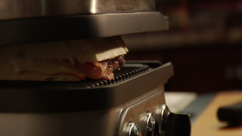 chef grilling panini sandwiches