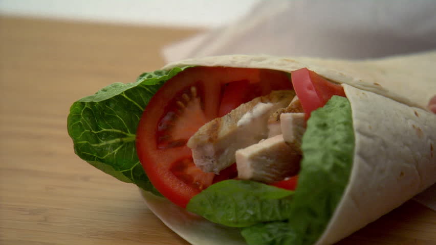 lock down of chicken wrap being wrapped in paper