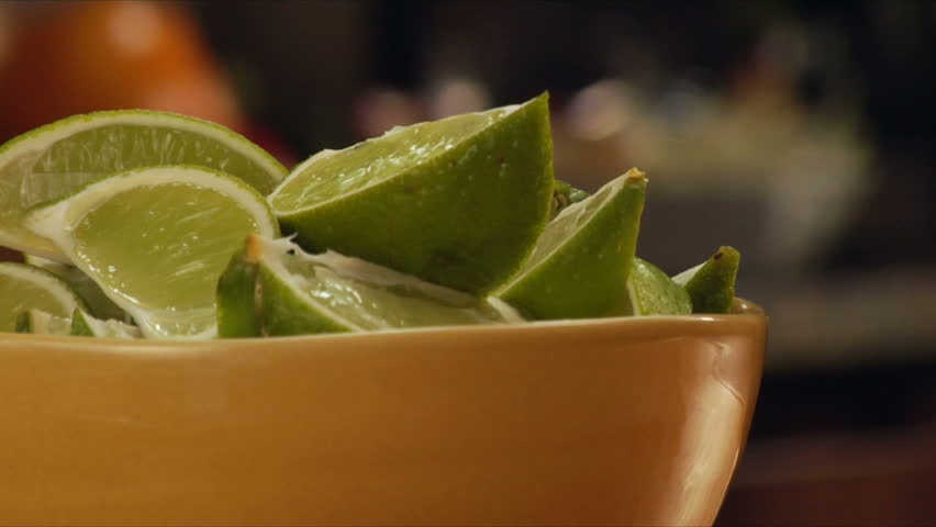 lock down of sliced limes, movement in background