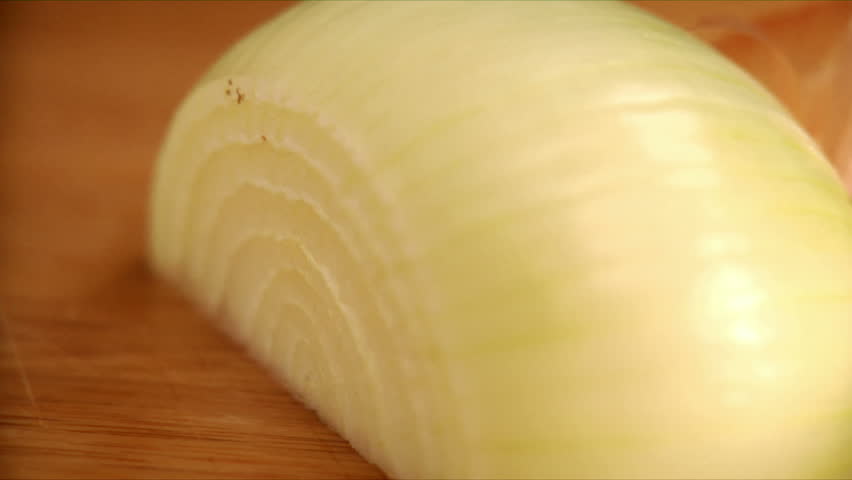 Close up of chef slicing onion