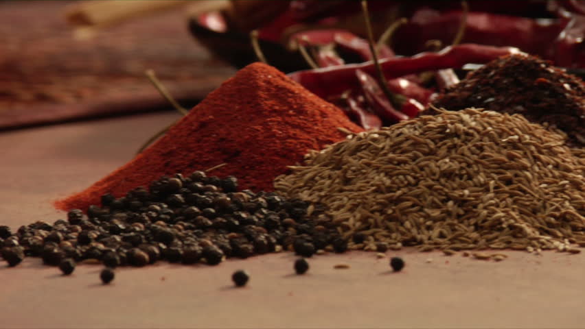 mexican chef selecting spices for a blend