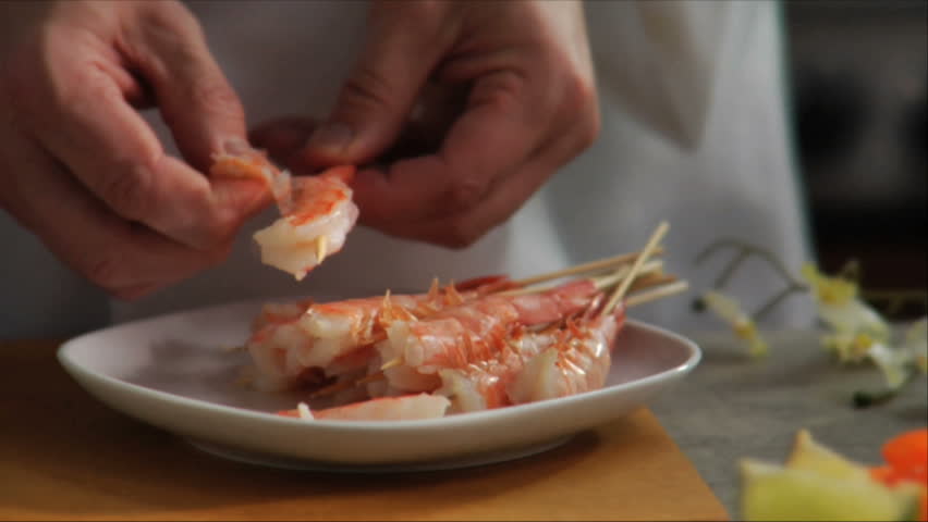 Chef peels shrimp for Asian appetizer