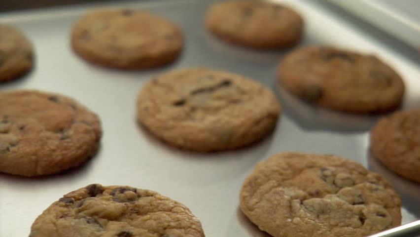 pan over tray of delicious chocolate chip cookies