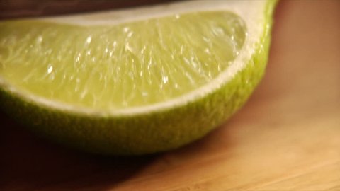 Follows action as chef slices a lime Stock Video
