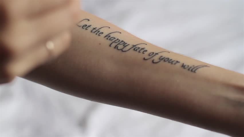Girl Smears Cream Tattoo on Her Hand