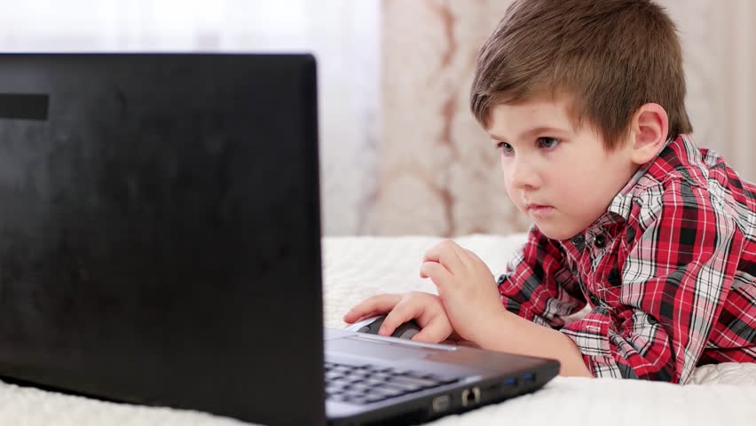 pix Little Kid On Computer Stock Image little boy using laptop computer stock footage video 100 royalty free 25415738 shutterstock