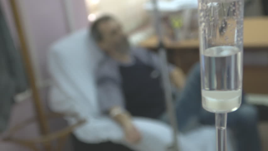 Patient out of focus with Infusion part of the medical treatment in the hospital clinic room,Handheld camera Balanced Steady shot  Royalty-Free Stock Footage #25422683