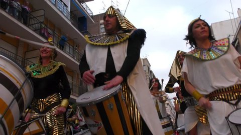 A group of drummers in batucada, dressed like egyptians, opens the Great Aguilas Carnival. Aguilas, Spain February 26th, 2017.