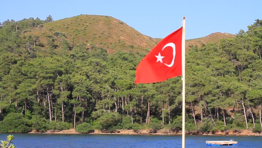 Turkish Flag on swimmers paradise beach in Marmaris, Turkey
