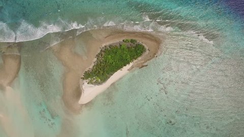 Aerial view of small deserted south pacific tropical island in Palau, Micronesia