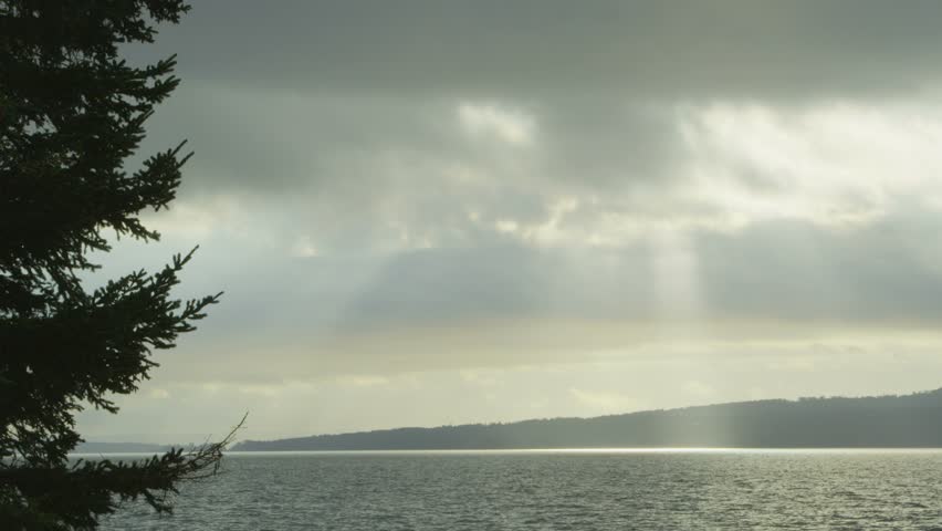 sun shining through clouds over nova scotia bay