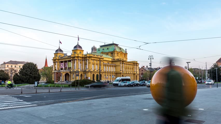 Zagreb Street day to night time lapse, in front of Croatian National Theatre square Zagreb, Croatia.