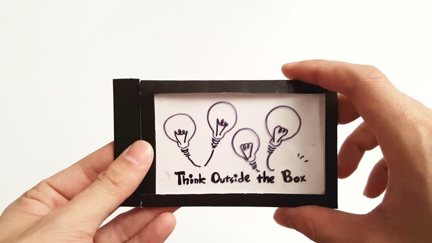 "Think Outside the Box" handmade concept artwork in fast motion effect.