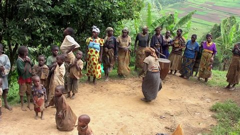LAKE BUNYONYI, UGANDA - OCTOBER 21: Batwa pygmies dancing on October 21, 2012 at Lake Bunyonyi, Uganda. Pygmy people are ancient dwellers in the forests, they were known as The Keepers of the Forest.