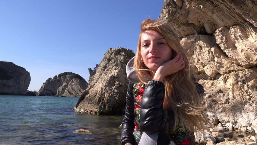 Beautiful girl on the sea coast 