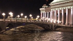 Eye Bridge at night and behind the Archeology Museum in Skopje, Macedonia. The bridge began construction in 2011.
