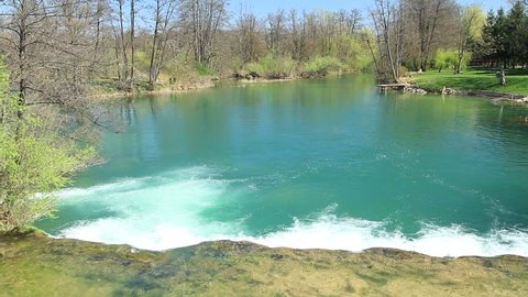 Beautiful countryside landscape, clear green water on Mreznica river in Croatia