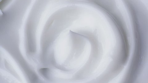 White gentle cosmetic cream. Cosmetics cream with rotate. Close-up shot.