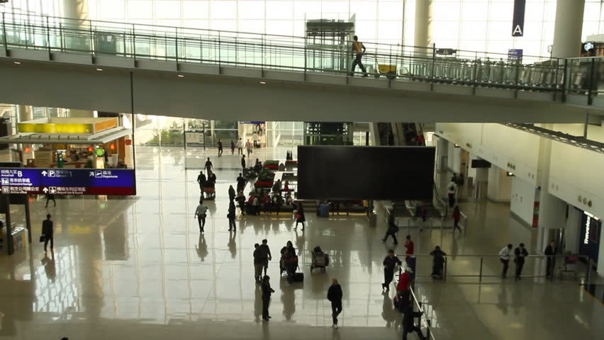 Time lapse of People in the arrivals hall at Hong Kong International Airport