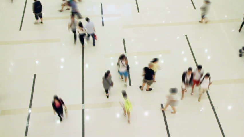 Blur of crowd walking through shopping center