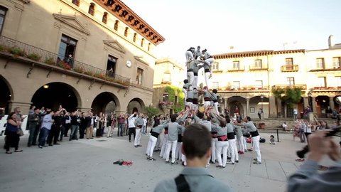 Barcelona, Spain - June 1, 2016 : Group of people makes human tower in Barcelona, Spain on June 1, 2016. Worldwide famous catalan human towers are on UNESCO's Cultural Heritage List.