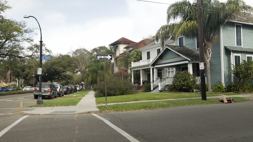 View of a lovely mid-city New Orleans neighborhood were residents typically have to park curb side because there is no off street parking.