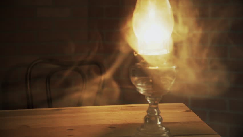 Entering a smoky room lit by flame of oil lamp a confederate officer spreads a map sits removes his gloves and starts marking up the map.