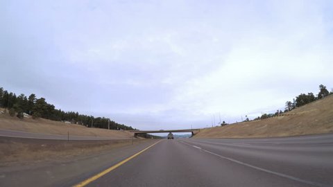 Denver, Colorado, USA-February 13, 2017. POV point of view - Driving through the mountains on interstate highway 70.