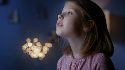 Wondrous Girl Serenely Looks out of the Window. Shot on RED EPIC-W 8K Helium Cinema Camera.