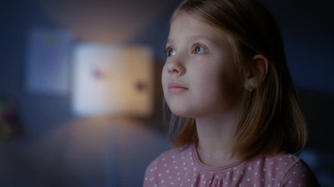 Wondrous Girl Happily Looks out of the Window. Shot on RED EPIC-W 8K Helium Cinema Camera.