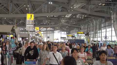 SAMUT PRAKAN, THAILAND - MAR 1, 2016 : People in Passenger Building of Suvarnabhumi Airport is one of two international airports Bangkok, Thailand. The airport is located in Bang Phli, Samut Prakan